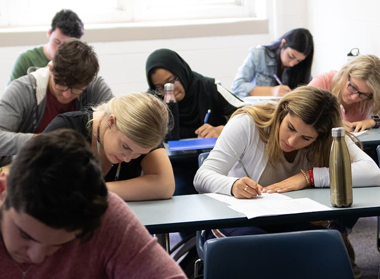 students in class writing